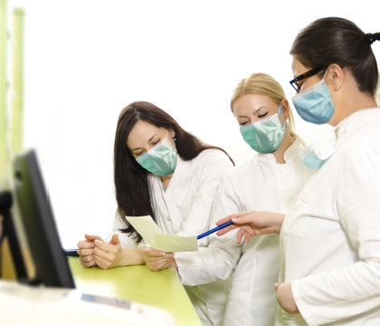Dental team members reviewing dental patient information